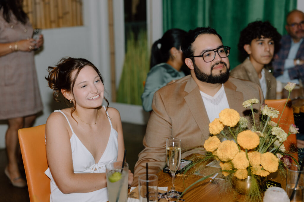 the bride and groom at their rehearsal dinner