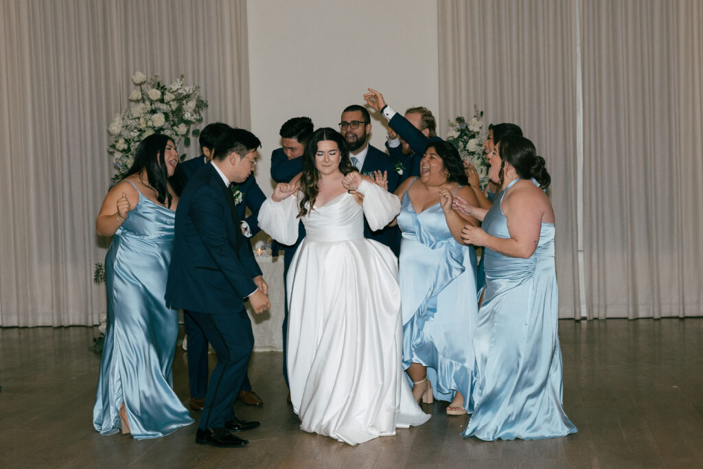 the bridal party and bride and groom