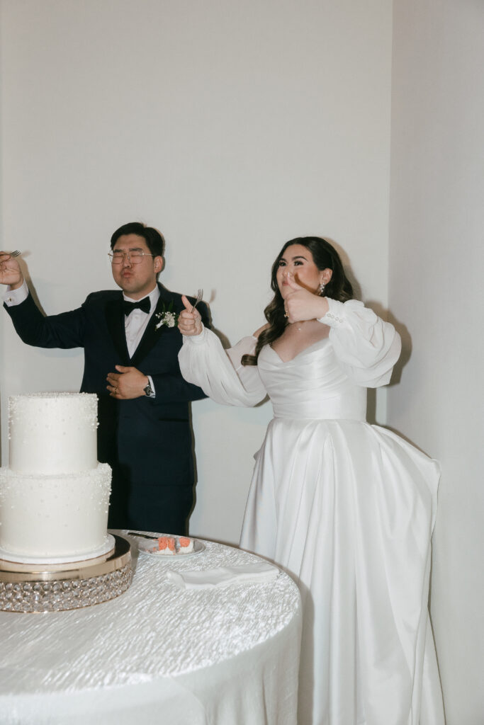 bride and groom cutting the cake