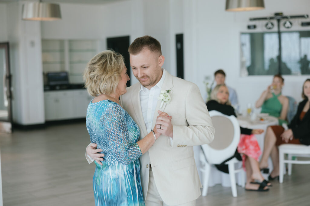 groom and mother of the groom dancing