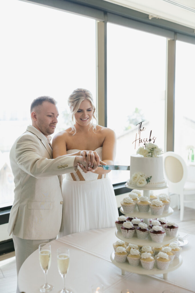cutting of the cake at Destin Florida Wedding