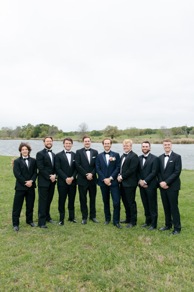 groomsmen at lakeside wedding in spring lakes ranch