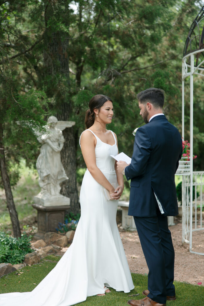 Groom reading personal vows to the bride at La Bella Luna.