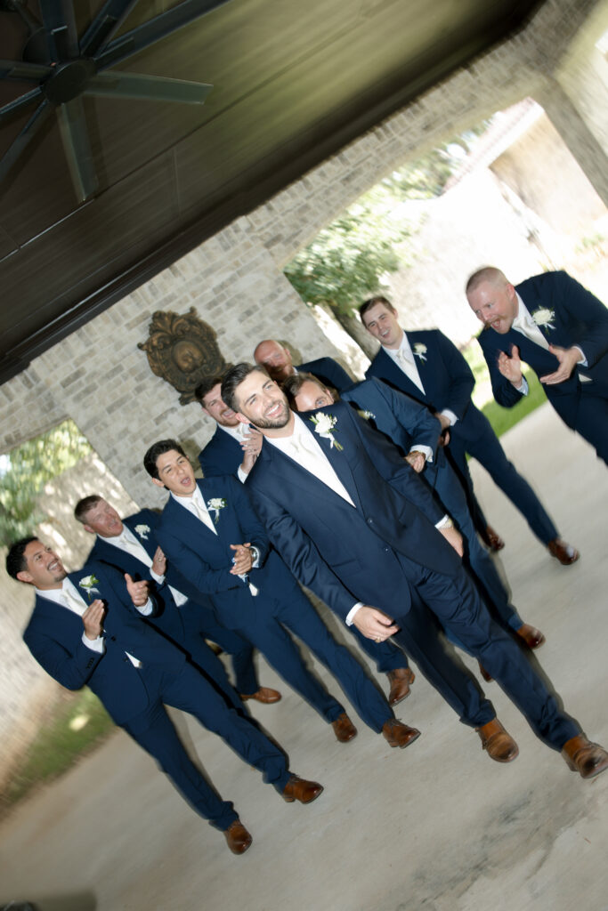 Groomsmen walking together outside of La Bella Luna.