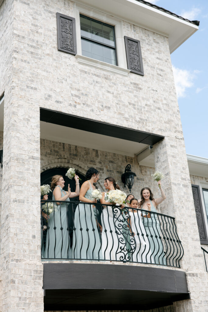 Bridal party on the balcony of La Bella Luna in Granbury, Texas.