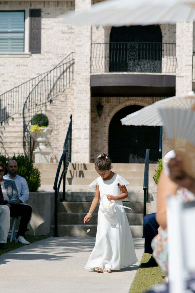 Flower girl walking down the aisle. 