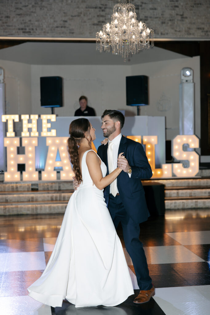 Bride and groom having their first dance during the wedding reception.