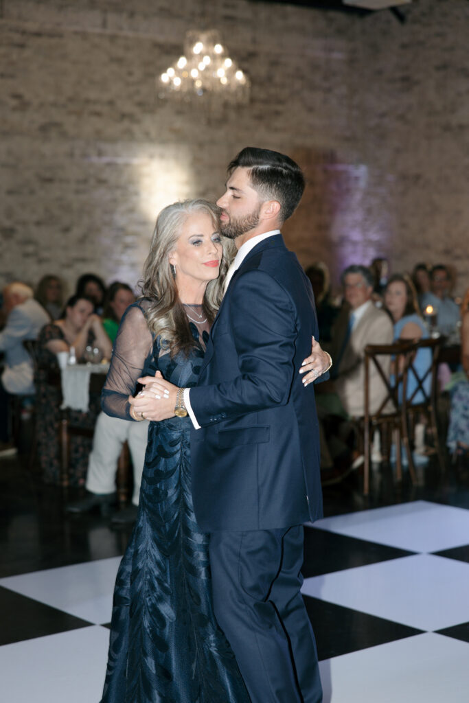 Groom and his mother slow dancing.
