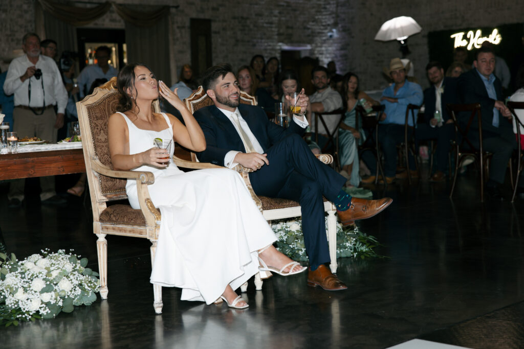 Bride and groom sitting during speaches.