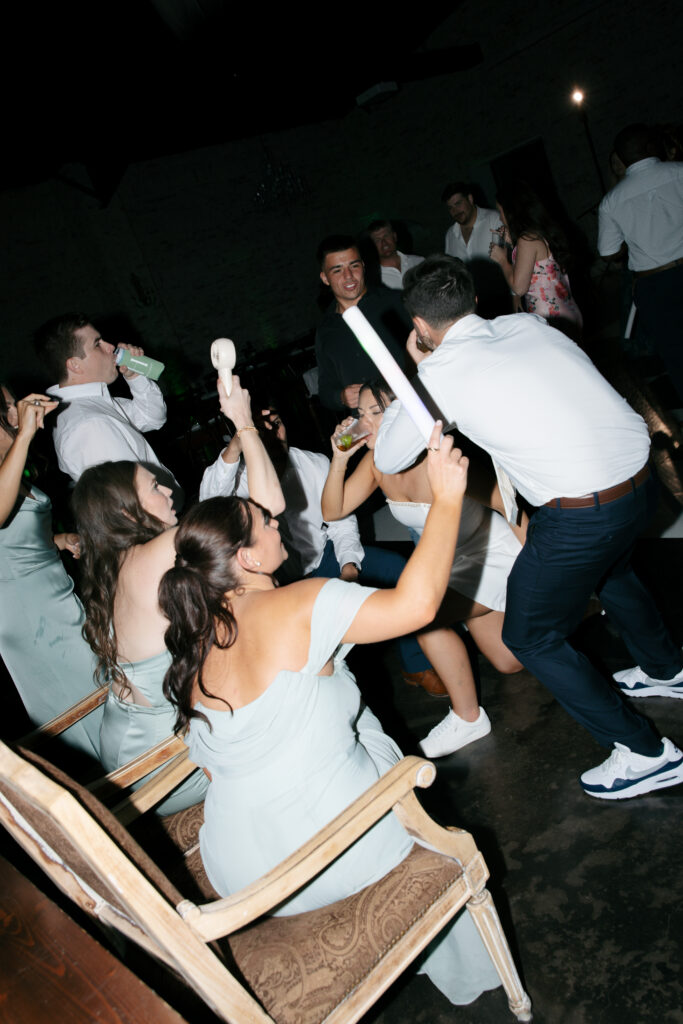 Bride and groom dancing and having fun with their wedding guests.