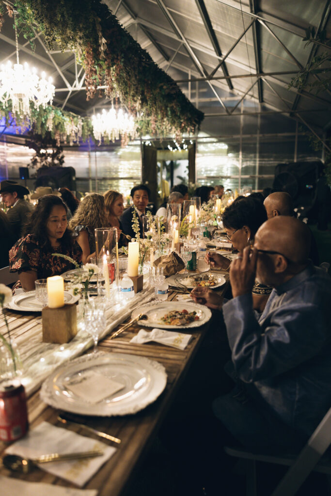 Guests enjoying a relaxed dinner, reflecting intimate wedding ideas.