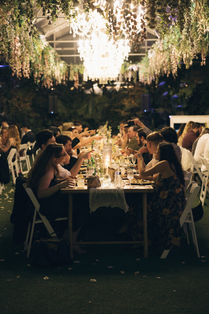 Guest enjoying a reception dinner filled with intimate wedding ideas. 
