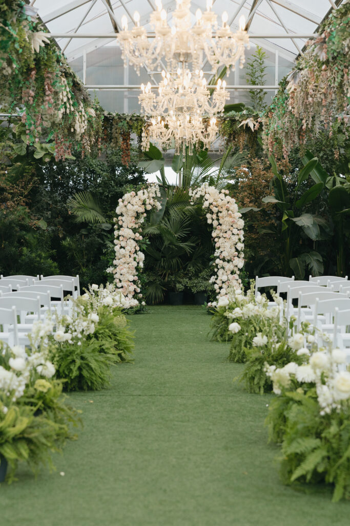 Beautiful wedding ceremony setup with roses and greenery at Honey Locust Farms in Rockwall, Texas.