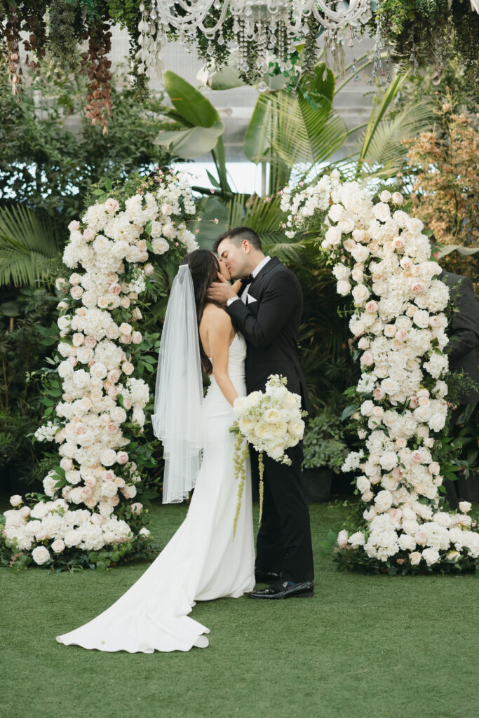 Bride and groom kissing after saying "I do"