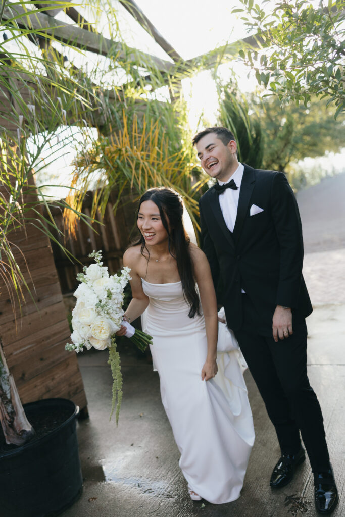 Couple smiling and laughing after the ceremony.