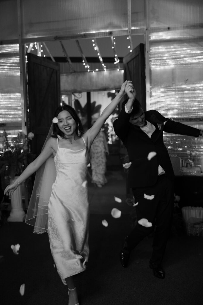 Bride and groom dancing as they enter the reception.