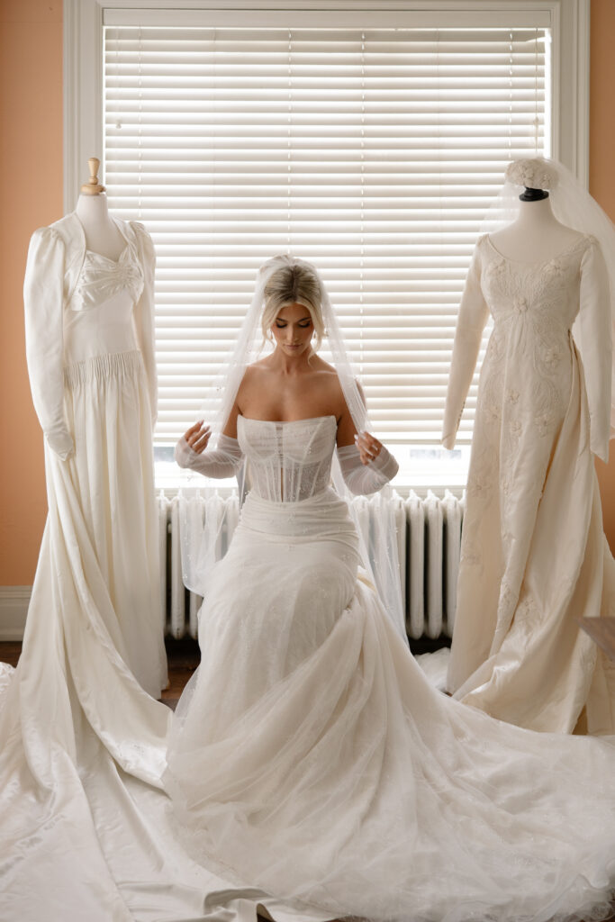 Bride adjusting her veil at the Historic Aldredge House in Dallas.